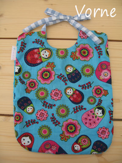 Latz-vorne-tuerkis-Matroschka-hinten-frottee-eigenname